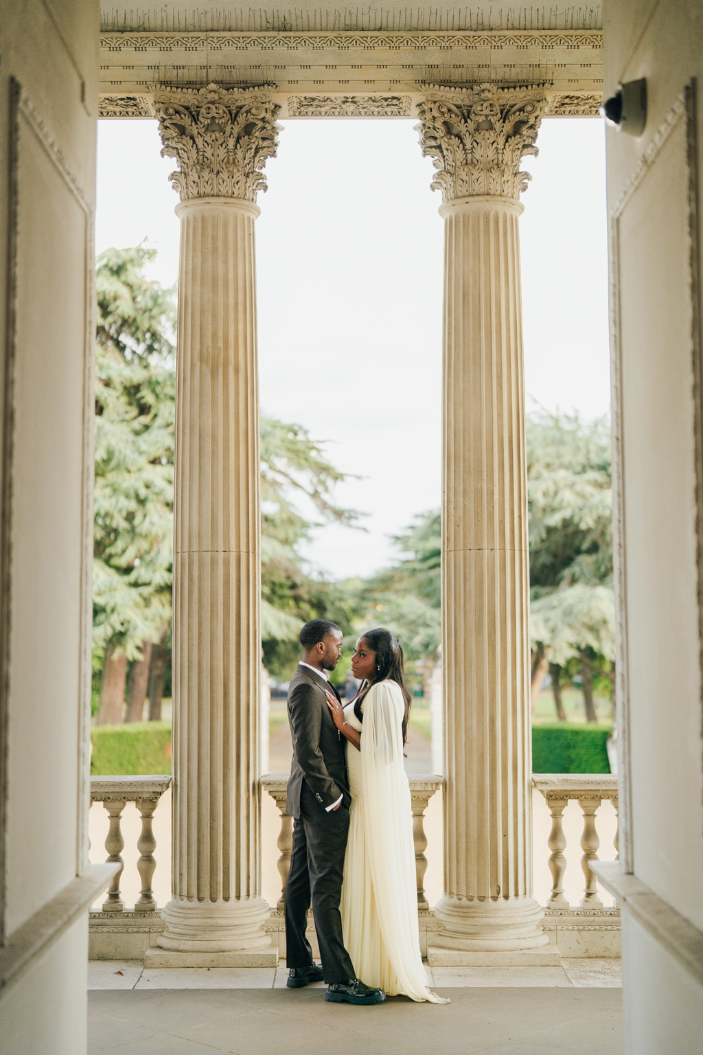 Davina and Peter between elegant columns